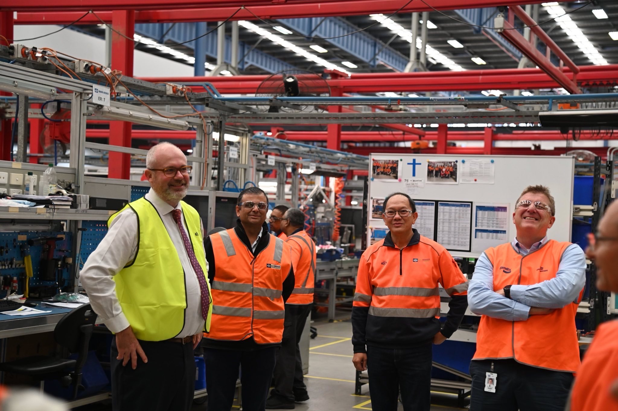 Assistant Minister Tim Ayres with factory workers in a factory