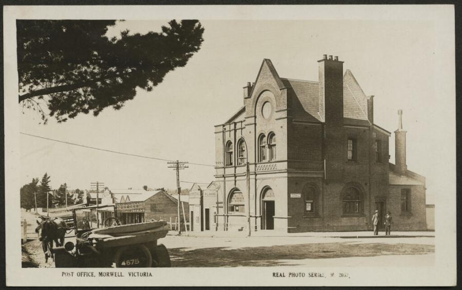 Black and white old photo of a double storey federation brick building
