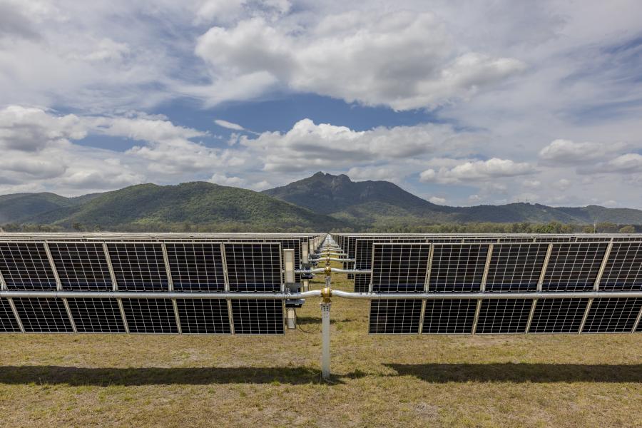 Rows of solar panels installed in an open field