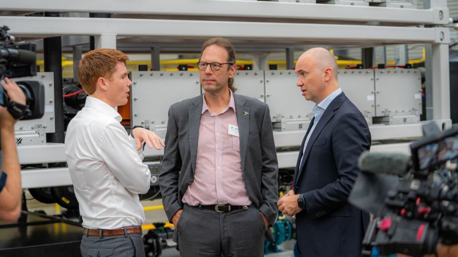 Professor Thomas Nann talking with two colleagues
