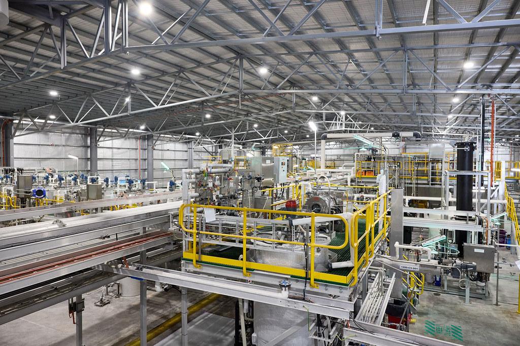 The interior of the Alpha HPA facility, with a variety of industrial machinery