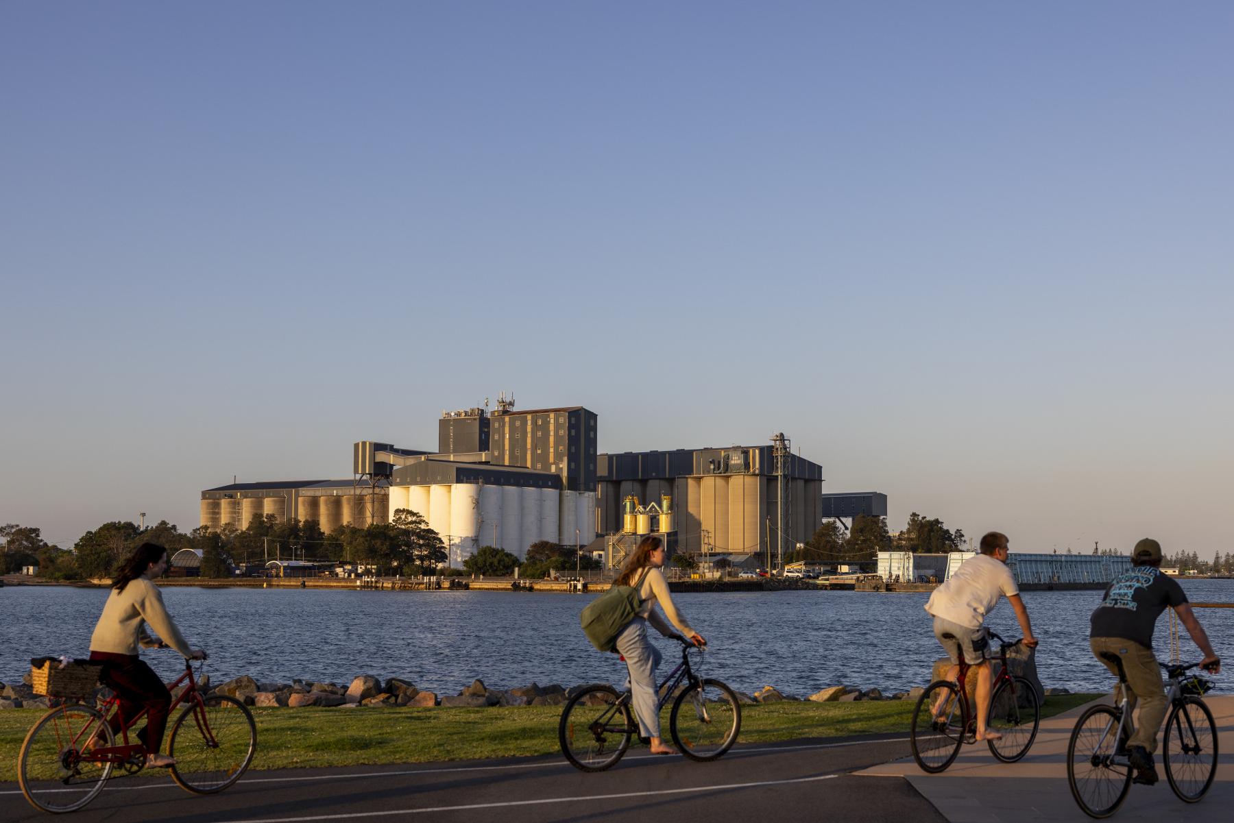 Cyclists on boardwalk in Port of Newcastle