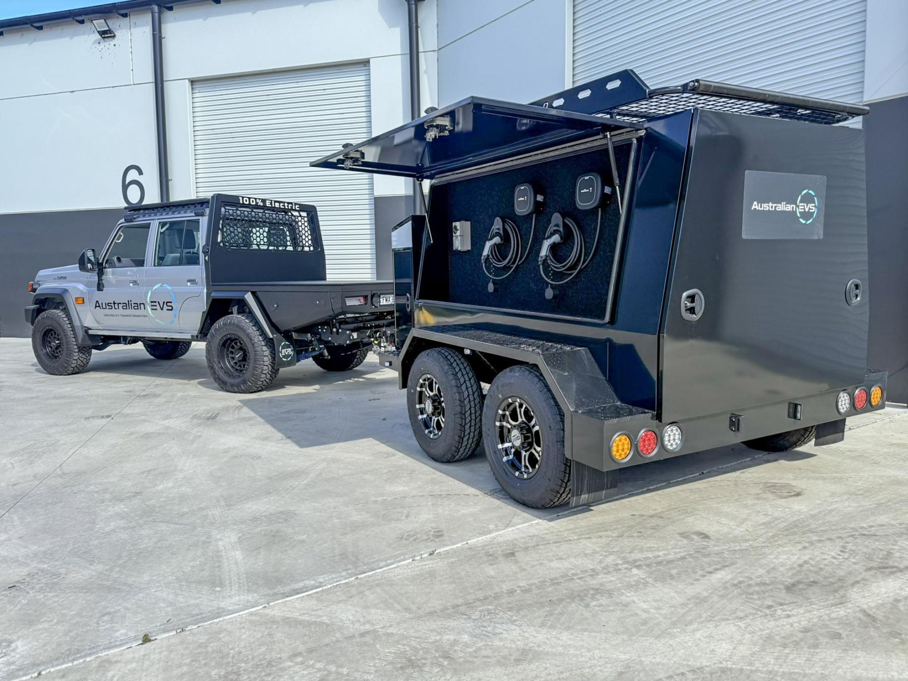Ute pulling a trailer with a large battery