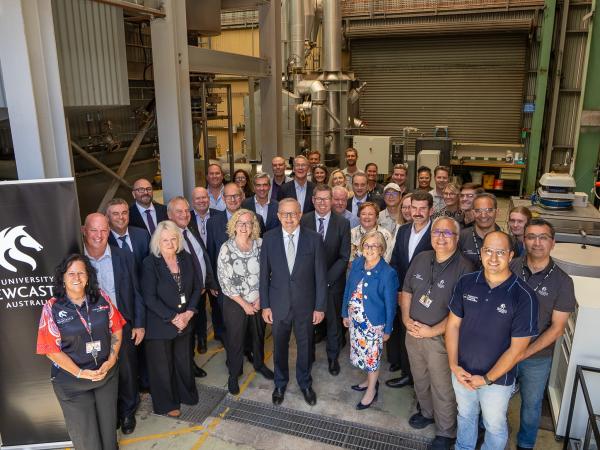 Prime Minister Anthony Albanese alongside personnel from the University of Newcastle