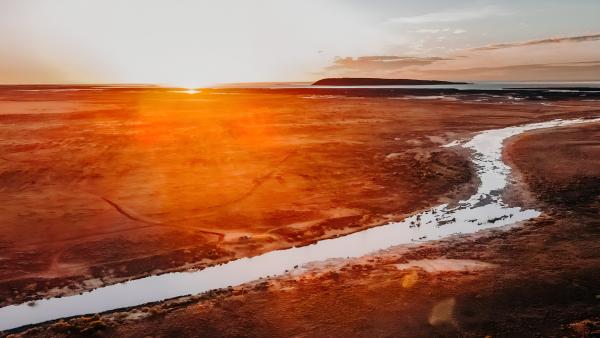 River flowing through the grassland, the Pilbara region, Western Australia