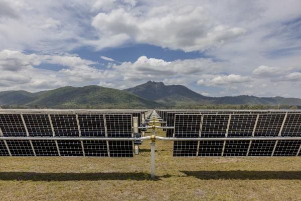 Rows of solar panels installed in an open field