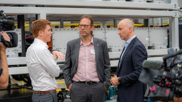 Professor Thomas Nann talking with two colleagues