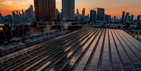 City horizon line featuring rooftop solar panels